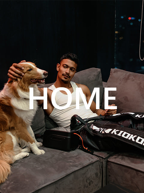 Person relaxing at home while wearing KIOKOP compression boots