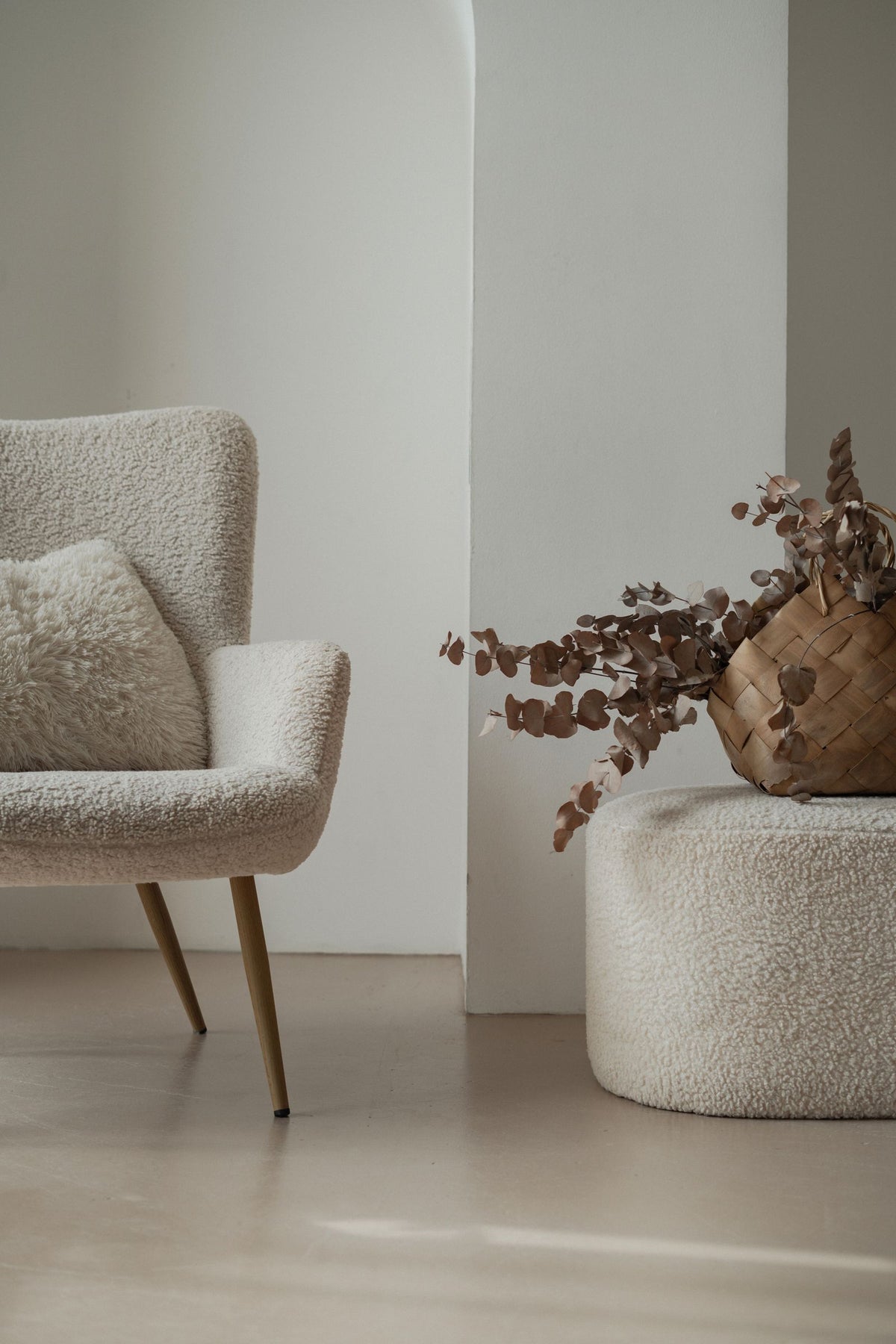 Armchair and plant in a quiet living room corner