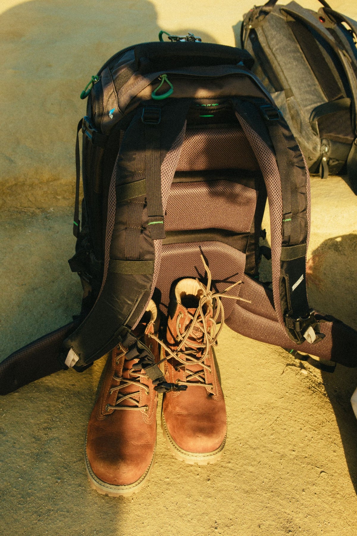 Hiking backpack and walking boots prepared for an outdoor trip