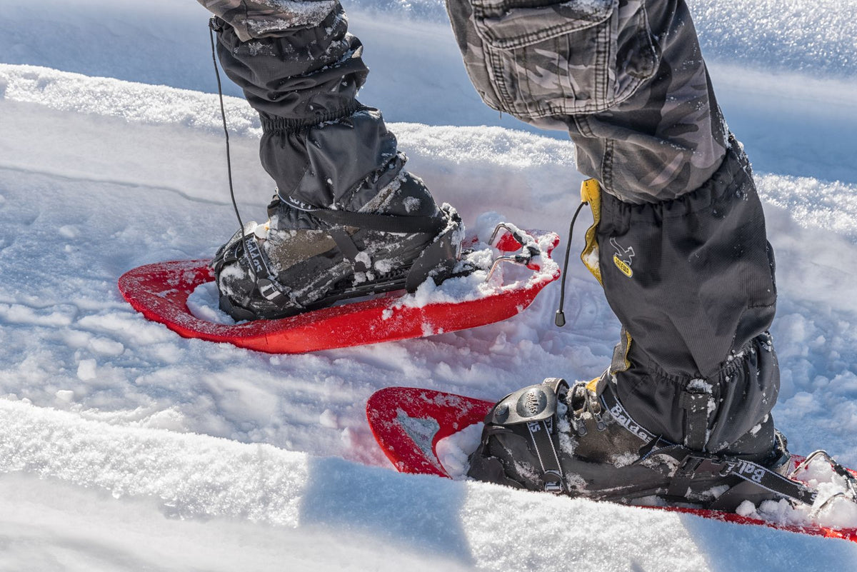 Snowshoes on a snowy trail in the Italian Alps