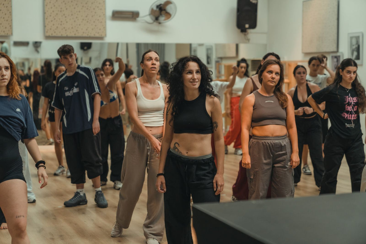 Adults practising dance together in a studio