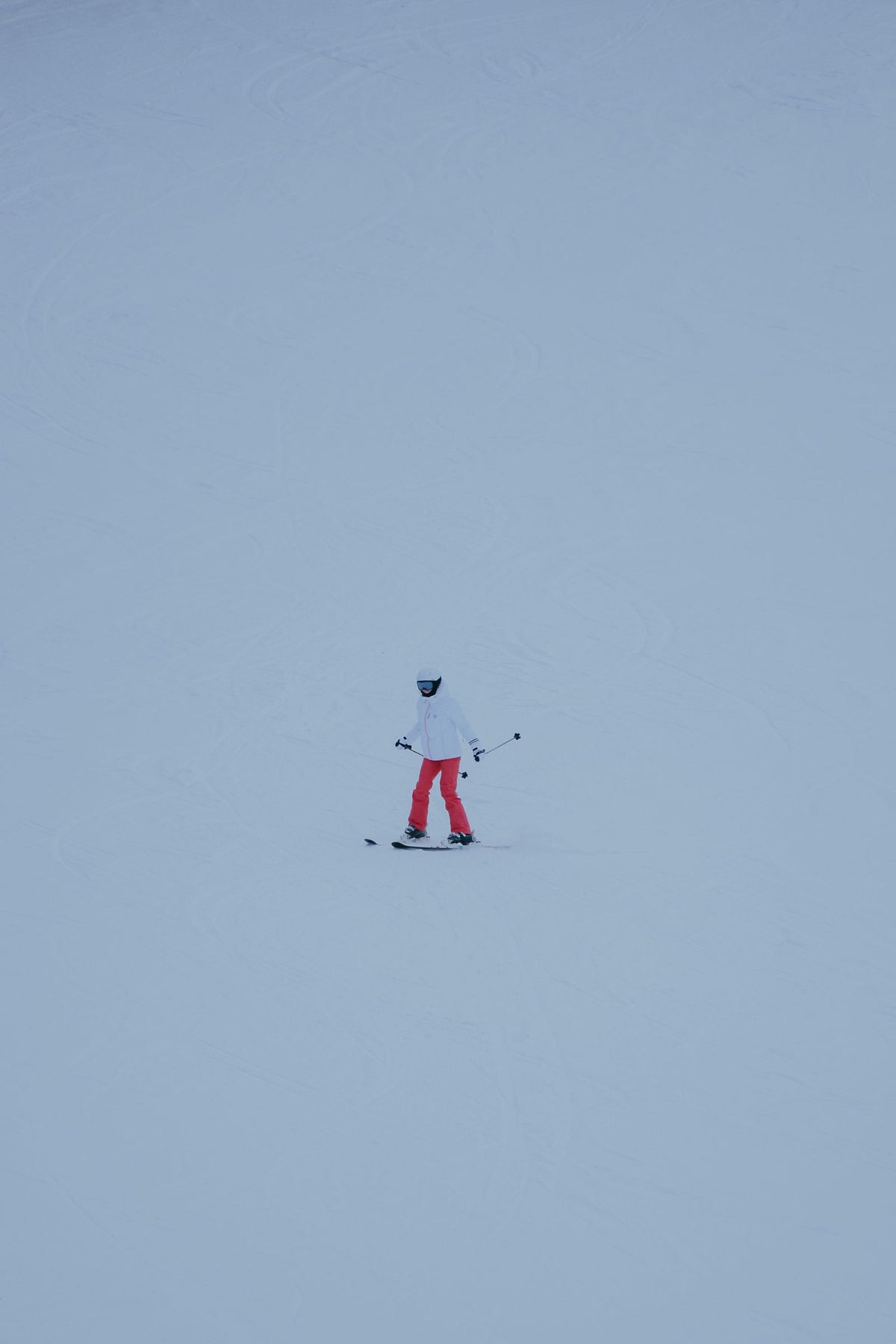 Skier on an open snow-covered slope