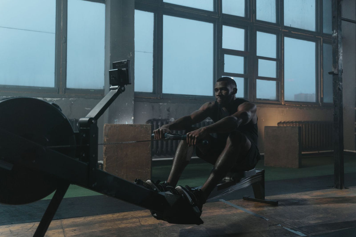 Athlete exercising on an indoor rowing machine