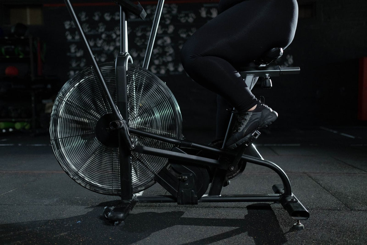 Person exercising on a stationary bicycle