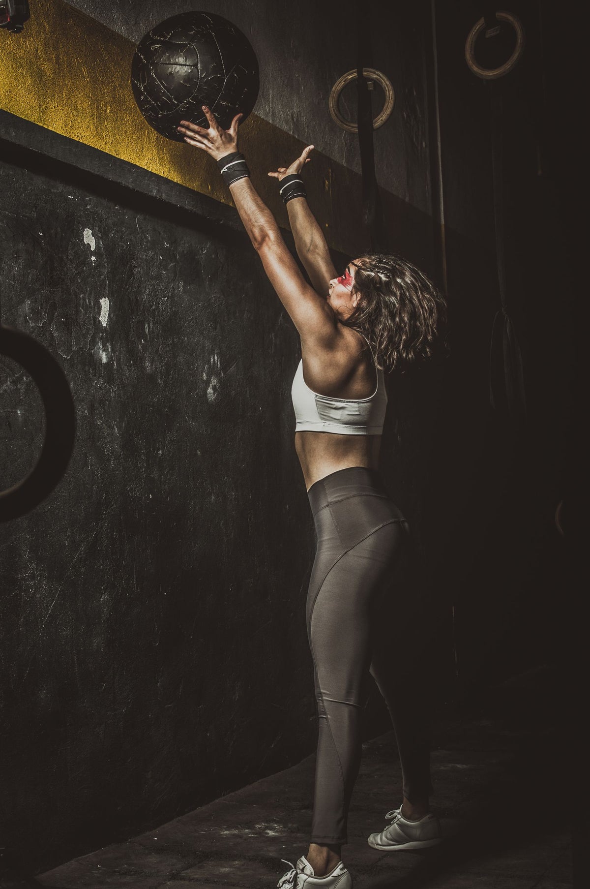 Athlete throwing a medicine ball in a gym